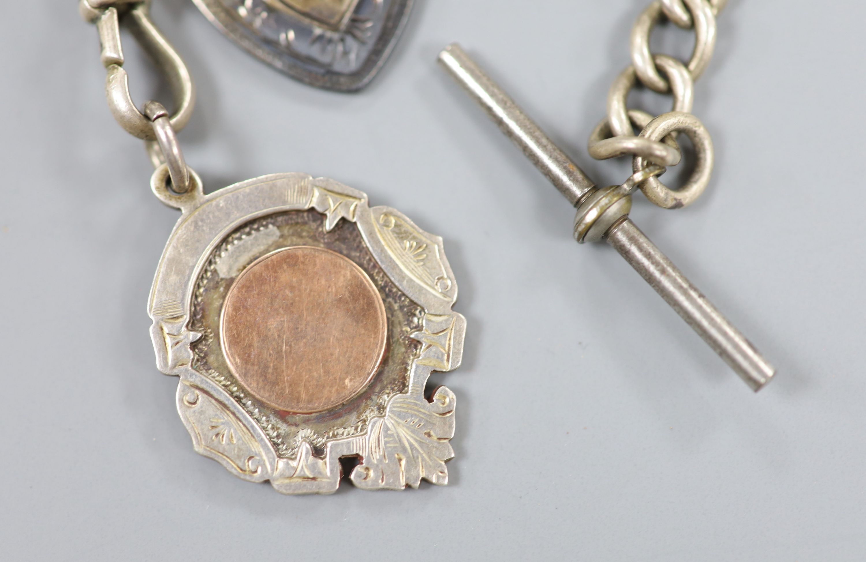 A 1940's silver cased propelling pencil, four assorted silver medallions and a silver albert.